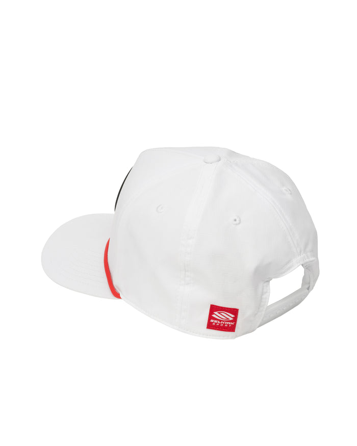 White baseball cap with flat brim, red under-brim accent and red rectangular brand tag at back