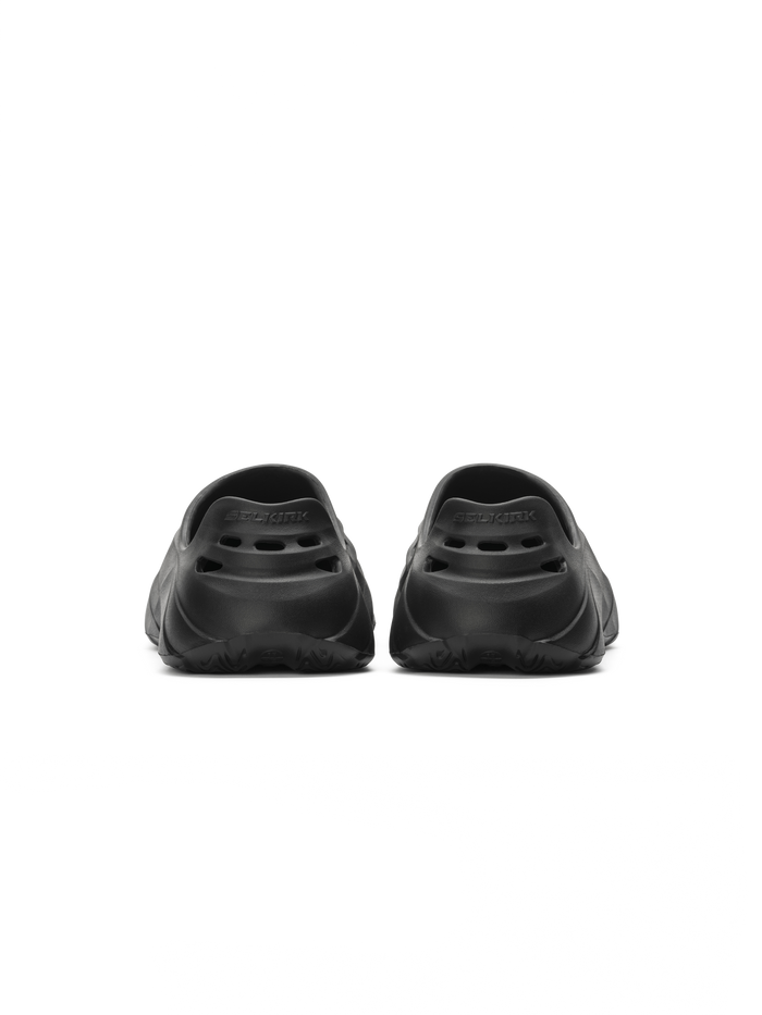 Rear view of Selkirk Renew recovery shoe pair, molded slip-on EVA with ventilation holes and heel logo on white background