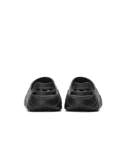 Rear view of Selkirk Renew recovery shoe pair, molded slip-on EVA with ventilation holes and heel logo on white background