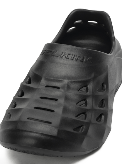 Angled front view of Selkirk Renew Recovery Shoe showing ventilated EVA upper and embossed SELKIRK logo on white background