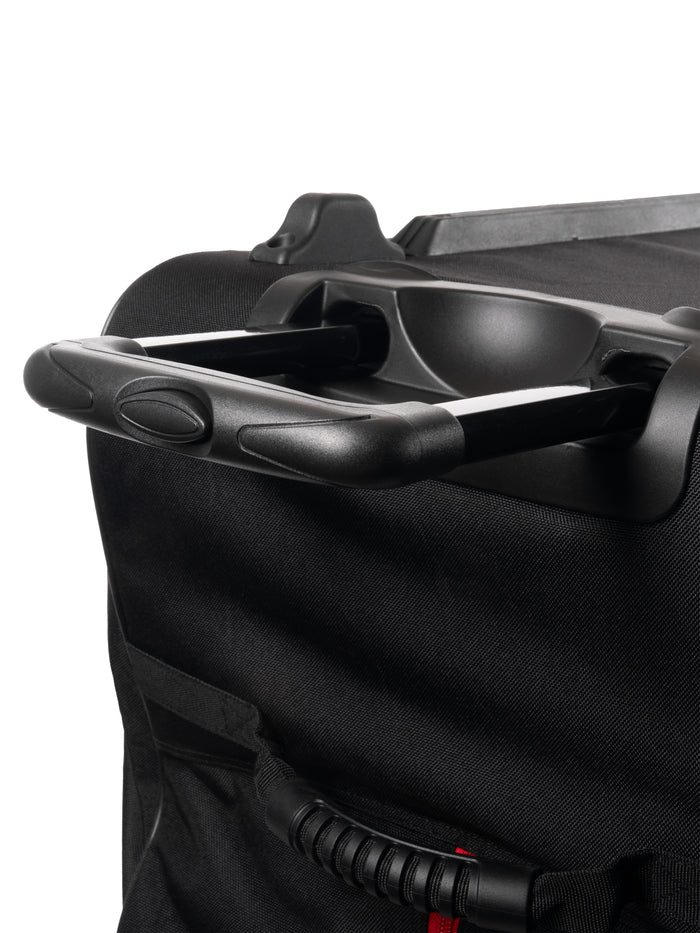 Telescoping suitcase handle with molded cup holder and textured black fabric exterior