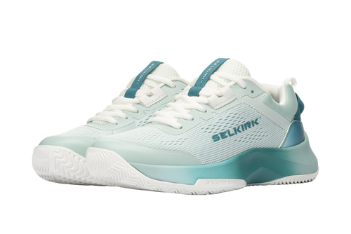 Light teal athletic court shoes with white laces and SELKIRK logo on the side