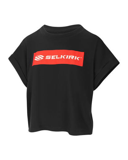 Black cropped T-shirt with red rectangular logo reading SELKIRK TM centered on the chest