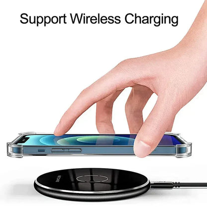 a hand is touching a wireless charger