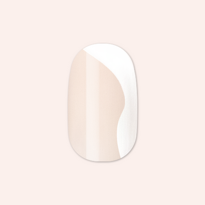 Side Swirl | Short | Round - Tab Press-On displaying a neutral pink nail with a subtle pastel side swirl design