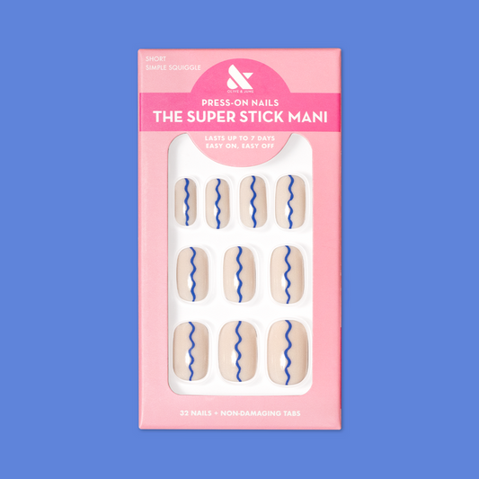 Simple Squiggle | Short | Squoval - Tab Press-On nails with neutral base and blue squiggle design in pink packaging on blue background