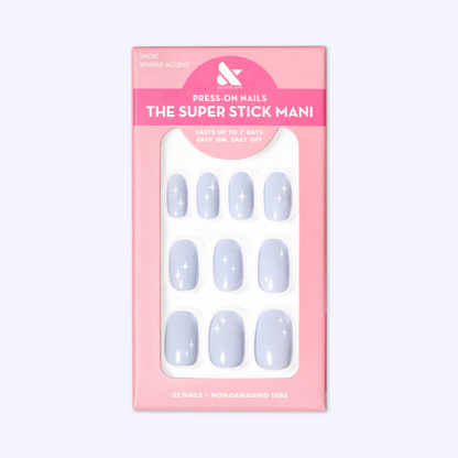 Sparkle Accent | Short | Round - Tab Press-On showing light blue false nails with white sparkle designs in pink packaging