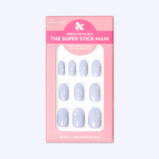 Sparkle Accent | Short | Round - Tab Press-On showing light blue false nails with white sparkle designs in pink packaging