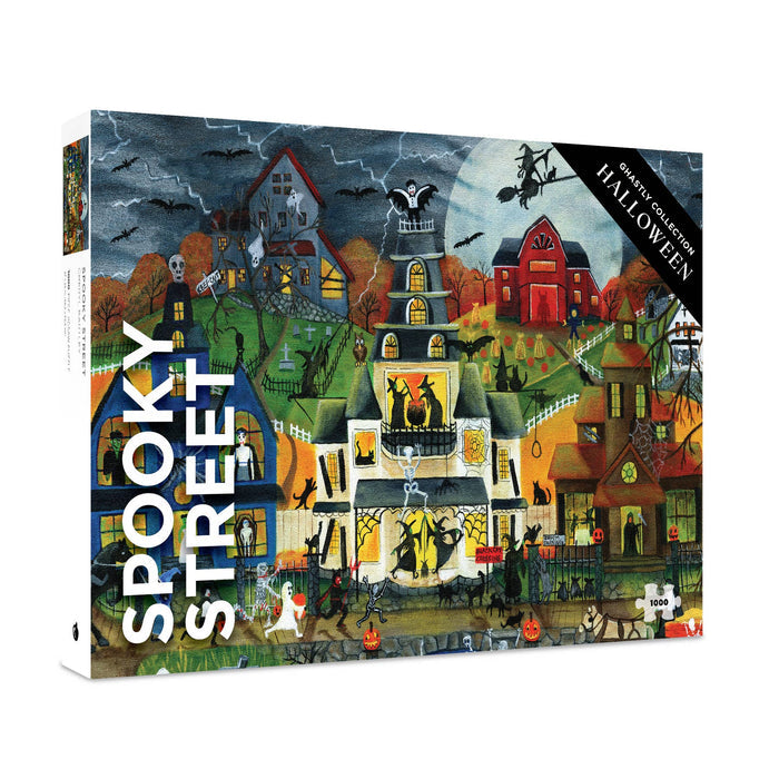 The Spooky Street | 1,000 Piece Jigsaw Puzzle by Pomegranate showcases a Halloween-themed scene filled with decorated houses, pumpkins, skeletons, bats, and a stormy sky. This festive puzzle promises hours of fun and makes an ideal activity for spooky season gatherings.