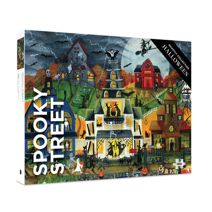 The Spooky Street | 1,000 Piece Jigsaw Puzzle by Pomegranate showcases a Halloween-themed scene filled with decorated houses, pumpkins, skeletons, bats, and a stormy sky. This festive puzzle promises hours of fun and makes an ideal activity for spooky season gatherings.