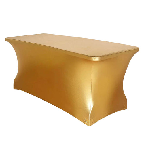 Gold table cover draped over a rectangular table for elegant events.