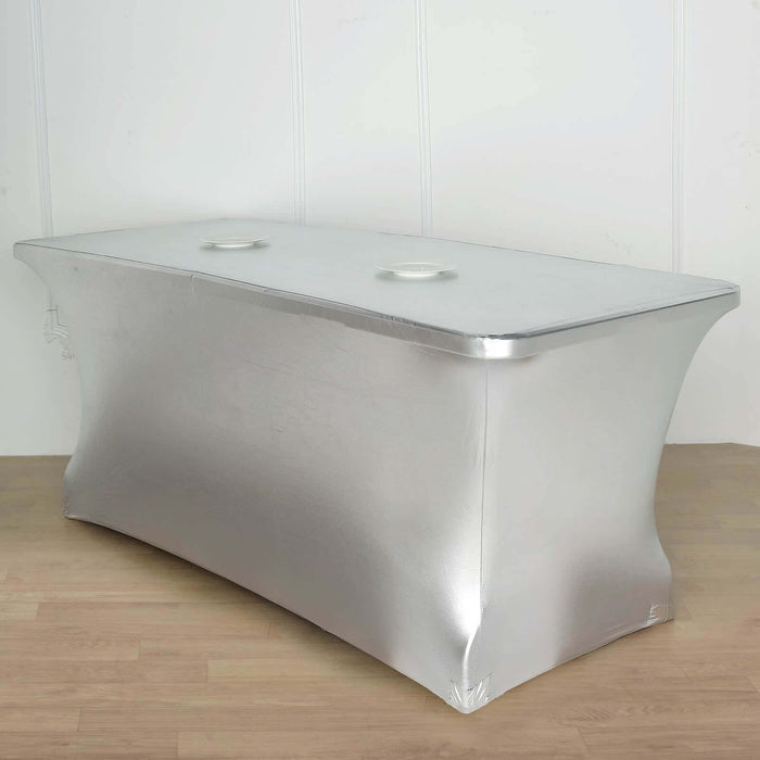 Silver table cover with cutouts for easy access.
