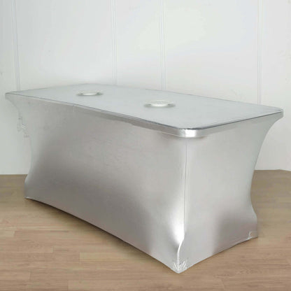Silver table cover with cutouts for easy access.