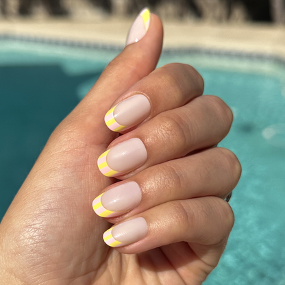 Summer Stripe French - Press-On | Short | Round milky sheer nails with vibrant citrus-striped tips for easy at-home mani