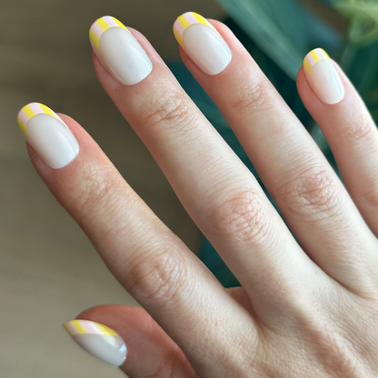 Summer Stripe French - Press-On | Short | Round short round press-on nails with milky sheer base and yellow citrus striped tips mani