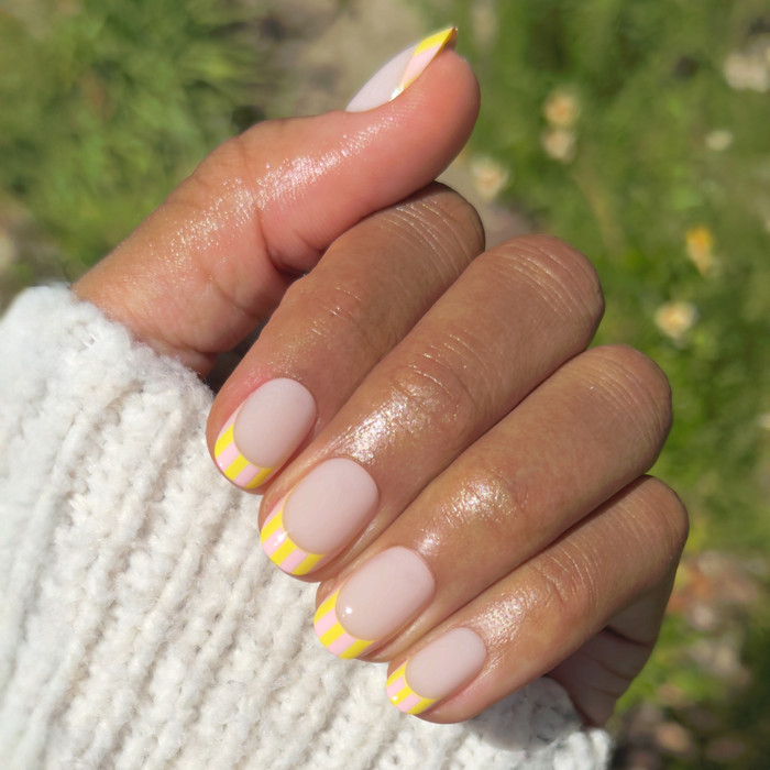 Summer Stripe French - Press-On | Short | Round milky sheer nails with bright citrus striped french tips for easy at-home mani