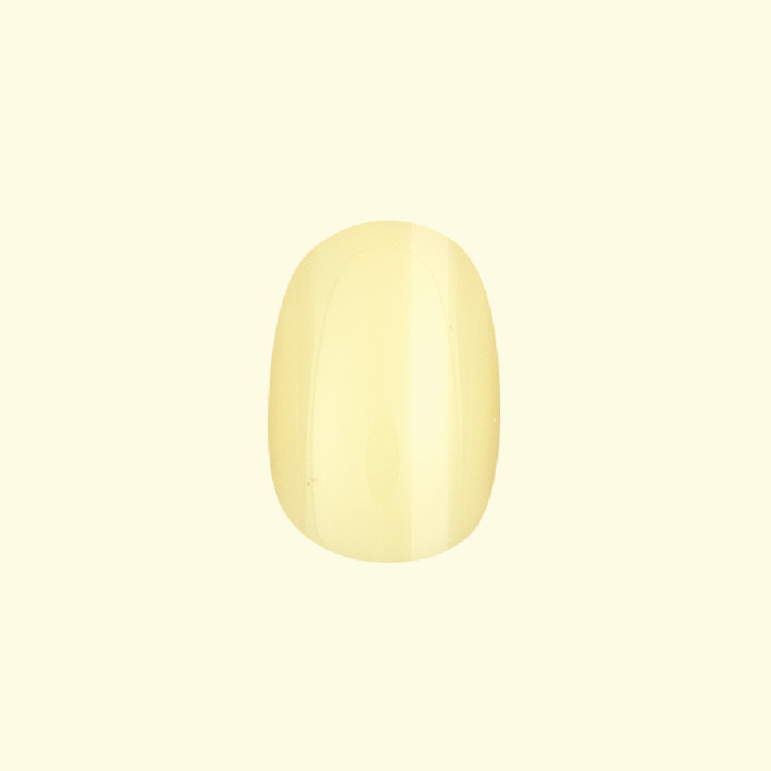 Sunny | Extra Short | Round - Tab Press-On nail in glossy pastel yellow perfect for cheerful at home manicures and easy press on wear