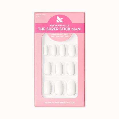 Swan | Extra Short | Squoval - Tab Press-On showing white press-on nails in pink packaging for at-home manicure
