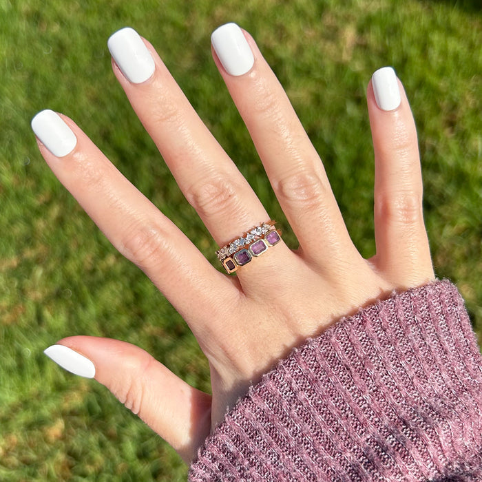 Swan | Extra Short | Squoval - Tab Press-On showing hand with crisp white false nails and rings outdoors in natural light