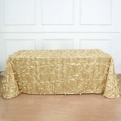 Gold textured tablecloth draped on a table in a bright room.