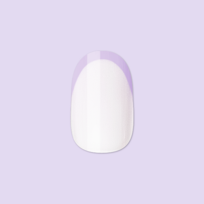 Tonal Lavender French | Extra Short | Round - Tab Press-On nail with lavender French tip on white base against lavender backdrop