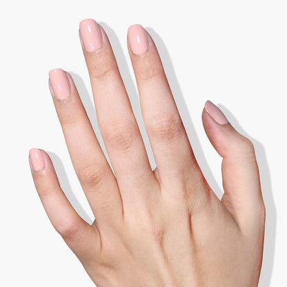 A hand with well-manicured nails painted in LONDONTOWN's Uncovered UV/LED Gel Color, shown against a white background.