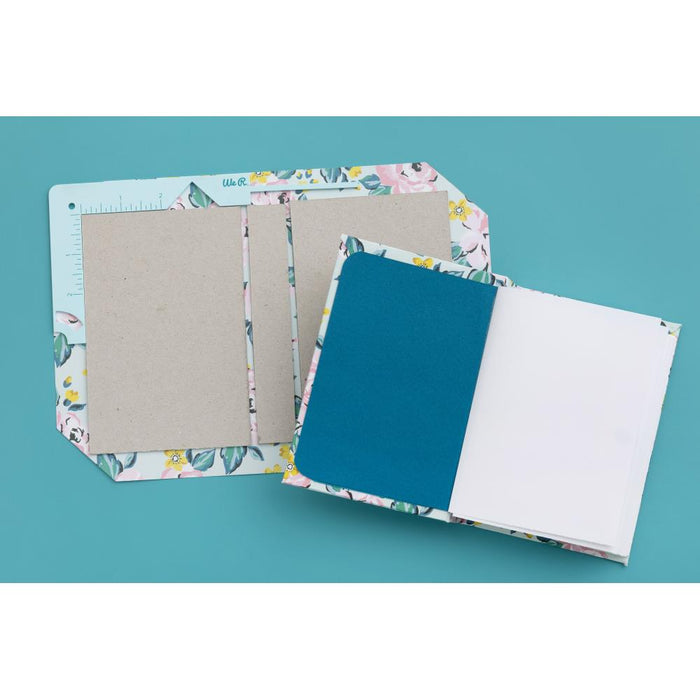 We R Memory - Book Cover Guide - Mint. Perfect book board placement, consistent gaps, trim corners at the proper angle, easily round corners and mark spot for elastic closure. It also includes a scan code for detailed instructions. Available at Embellish Away located in Bowmanville Ontario Canada.