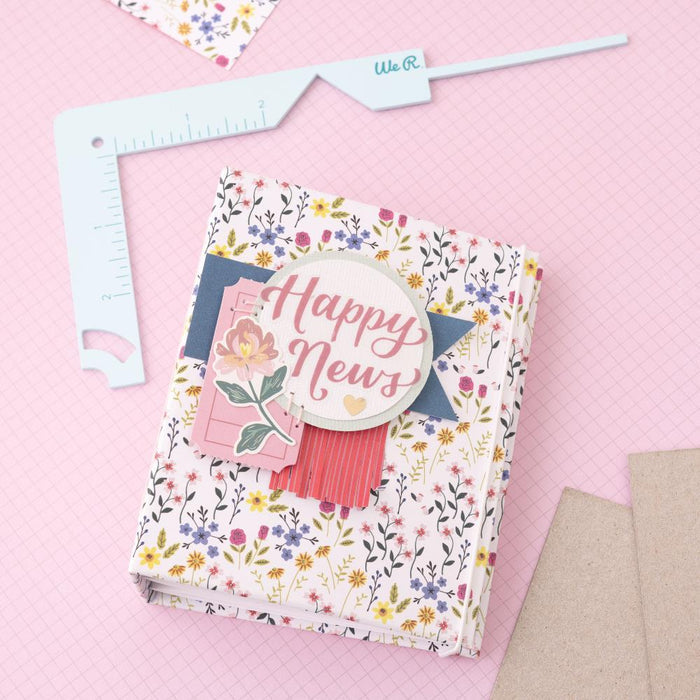 We R Memory - Book Cover Guide - Mint. Perfect book board placement, consistent gaps, trim corners at the proper angle, easily round corners and mark spot for elastic closure. It also includes a scan code for detailed instructions. Available at Embellish Away located in Bowmanville Ontario Canada.